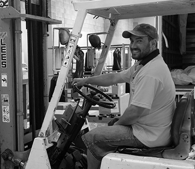 Man riding forklift